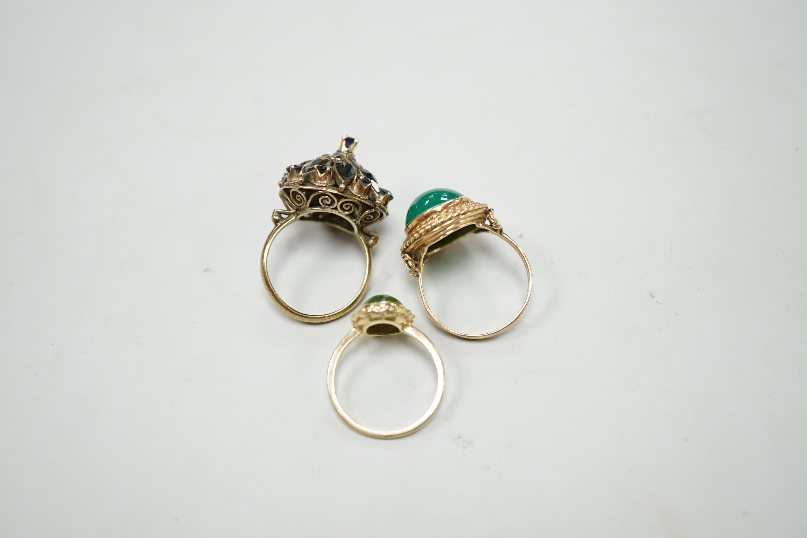 Three assorted yellow metal and gem set dress rings, including 14k and 10k, gross weight 13.2 grams.